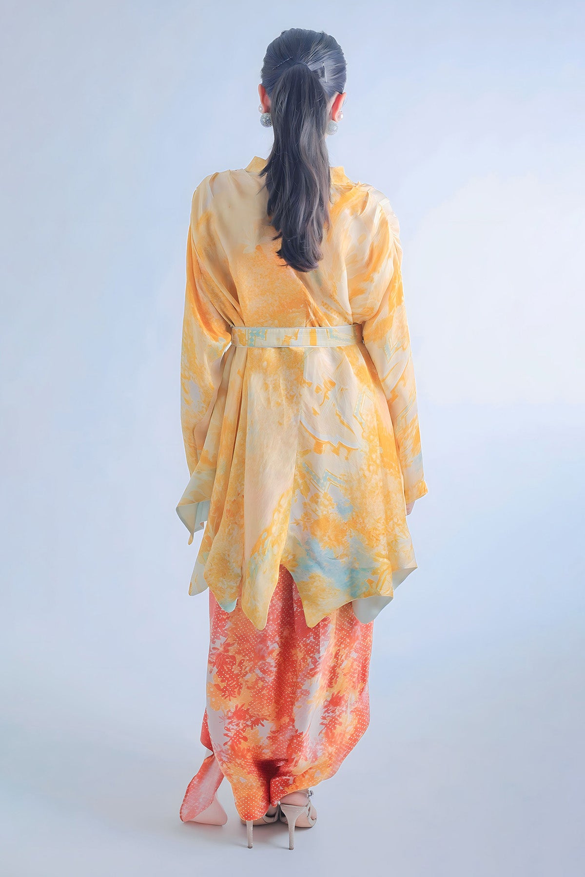 Kaftan Style Top Paired With Dape Skirt And Belt